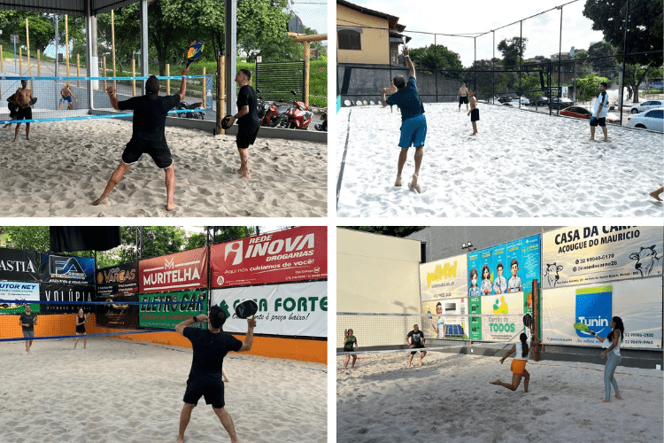 Jogadores de beach tennis se divertindo em uma quadra de areia em Muriaé.